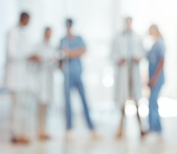 Group of doctors, nurses and blurred hospital, meeting and planning surgery or team schedule. Healt.